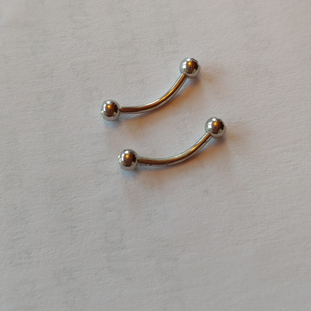 2 Pierced cartilage earrings. Helix rook cz screw